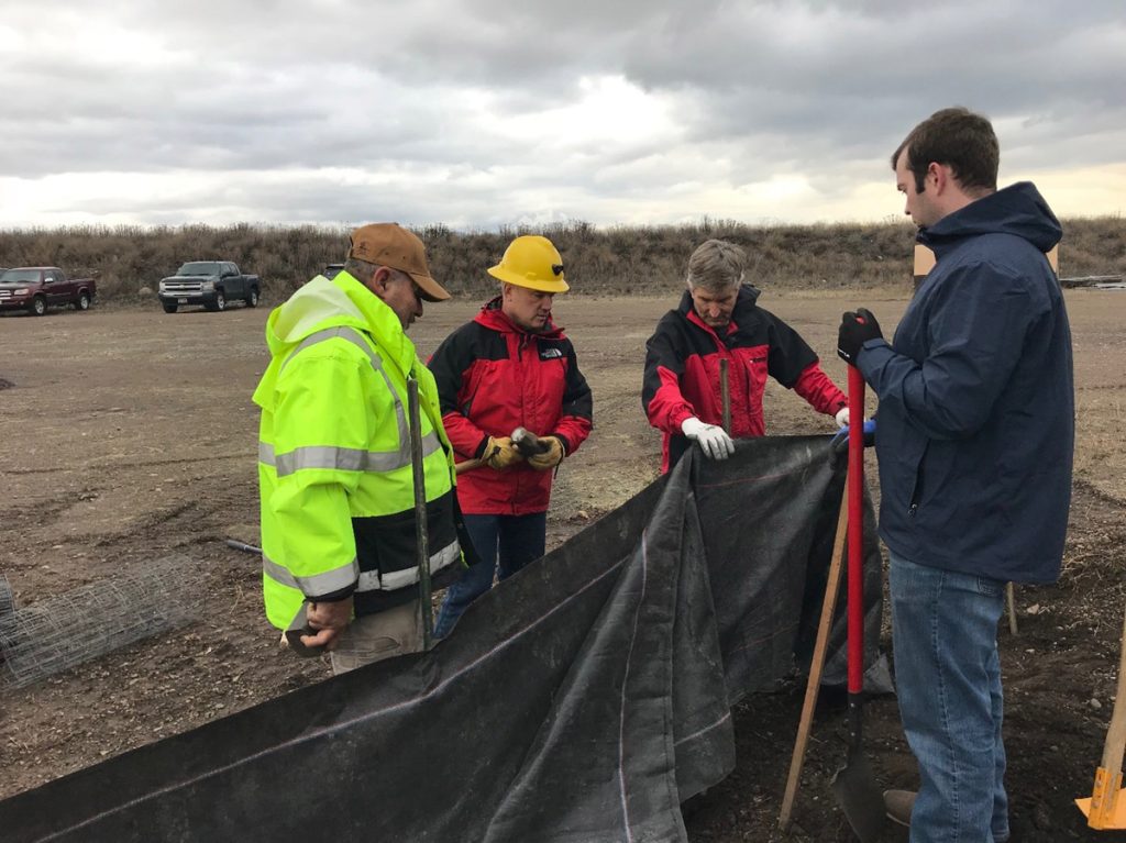 SEEP class instructors and participants install a silt fence, an erosion best management practice. (Photo: M. Schmidt)